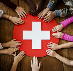 A group of young children learning about first aid