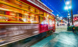 © jovannig - NEW ORLEANS - FEBRUARY 11, 2016: New Orleans streetcar at night, blurred view. The city attracts 15 million tourists every year