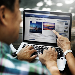 Wall Mural - senior asian man using laptop