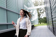© NDABCREATIVITY - Portrait of young beautiful businesswoman going to office