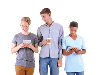 Wall Mural - Teenagers with tablet computers on white background