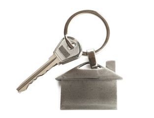 Poster - Key with trinket in shape of house on white background