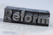 © Gina Sanders - reform written in lead letters