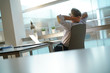 © goodluz - Businessman in office relaxing in desk chair