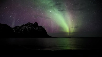 Wall Mural - northern lights aurora borealis time lapse over ocean, eystra horn, stokksnes, hofn, iceland, 4k