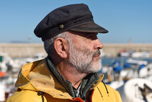Portrait Of A Fisherman In The Harbor