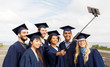 © Syda Productions - group of happy students or graduates taking selfie