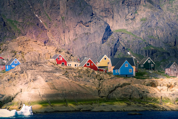 Greenland : bay with an inuit village, colored houses bay with an inuit village