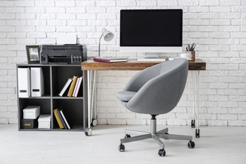 Poster - Comfortable workplace with computer monitor on table in office