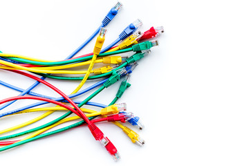 Colored patch-cord on white background top view copyspace