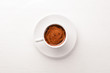 © Yaruniv-Studio - Espresso coffee cup on a white wooden background. Top view. Free space for text.