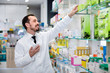 © JackF - Male pharmacist looking for right medicine