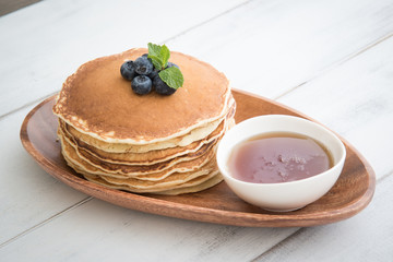 Wall Mural - isolated blue berry pancake with  syrup