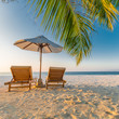 Beautiful beach. Chairs on the sandy beach near the sea. Summer holiday and vacation concept. Inspirational tropical scene. Tranquil scenery, relaxing tropical landscape design