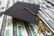 © zimmytws - Graduation cap on money