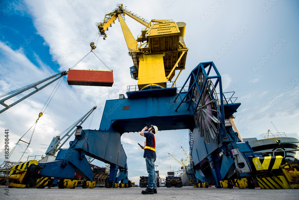 the port industrial gantry crane working under command of the loading ...