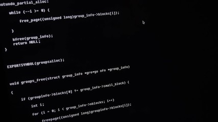 Close up view to screen computer laptop monitor. White letters on black background. Computer code. Hacker or programmer coding script exploit. Access granted denied. Download critical data.