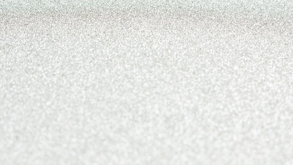 white glitter and bokeh for a background.