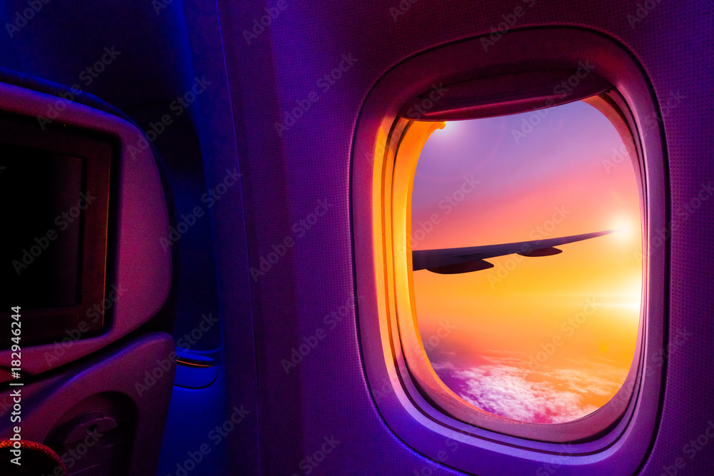 Beautiful scenic view of sunset through the aircraft window. Image save ...
