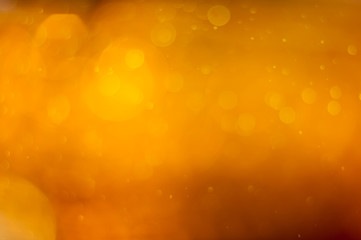 Sticker - golden orange bokeh or luxurious glitter lights festive background