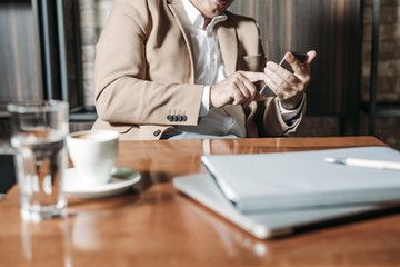 Wall Mural - Businessman Using Smartphone