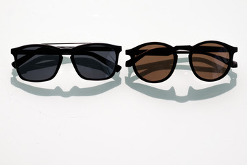 Two black sunglasses with funny shadow like man beard