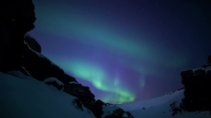 Wall Mural - aurora borealis moving snowy volcanic mountain pass reykjavik iceland.mov