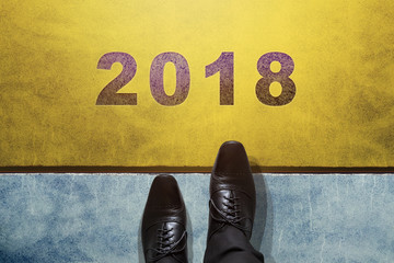 Concept for 2018 Year, Top view of Businessman on Oxford Shoes Steps into Start line, Business Challenge or do something new