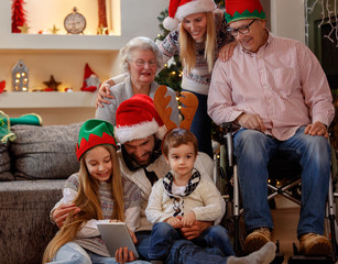 Wall Mural - family and elderly grandparents celebrating Christmas.