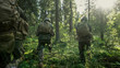 © Gorodenkoff - Squad of Five Fully Equipped Soldiers in Camouflage on a Reconnaissance Military Mission, Rifles Ready. They're Moving in Formation Through Dense Forest. Back View Shot.