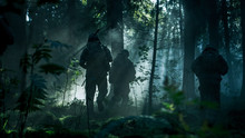 Squad Of Five Fully Equipped Soldiers In Camouflage On A Reconnaissance Military Mission, Rifles In Firing Position. They're Running In Formation Through Dense Dark Forest. Side View Long Shot.