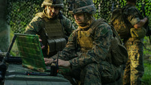 Military Staging Base, Officer Gives Orders To Chief Engineer, They Use Radio And Army Grade Laptop. They're In Camouflaged Tent In A Forest. They're On Reconnaissance Operation/ Mission.