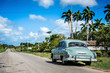 HDR - Amerikanischer grüner Chevrolet Oldtimer parkt am Strassenrand in der Provinz Villa Clara in Cuba - Serie Cuba Reportage