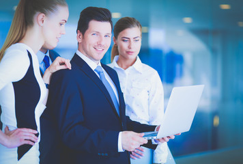 Wall Mural - Group of business people doing presentation with laptop during meeting. Group of business people