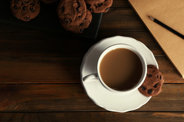 Wall Mural - Ceramic cup with delicious coffee on wooden table