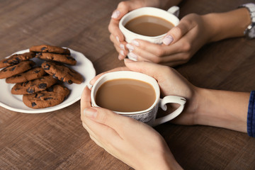 Wall Mural - Women having delicious coffee and biscuits for breakfast