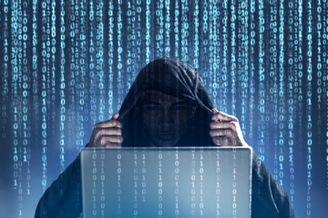 Unrecognizable hacker, zeros and ones, laptop