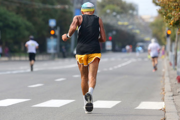 older athlete runs a marathon