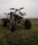 Fototapeta Na drzwi - ATV quad muddy on a field