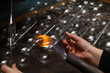 © neznamov1984 - Factory of Christmas toys. The worker blows out the glass. The b