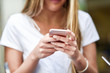 © javiindy - Close-up image of young blonde girl texting with smartphone