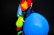 © rosinka79 - Some burst, deflated balloons and one inflated balloon hanging on threads.