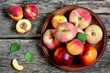 Colorful fruits apricot, nectarine and peach on a wooden table