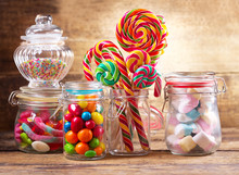 Colorful Candies, Lollipops And Marshmallows  In A Glass Jars