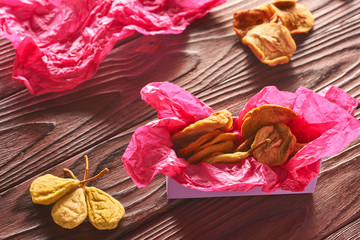 Sticker - Dried fruits on wooden background