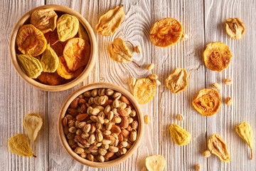 Canvas Print - Dried fruits and nuts on wooden background