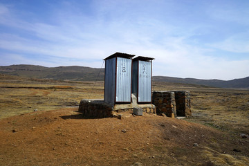 an isolated toilet in sani pass border in lesotho, africa.