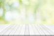White table top on green blurred background,space for montage product