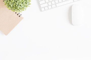 Wall Mural - flat lay photo of office desk with mouse and keyboard,copy space on white background,top view