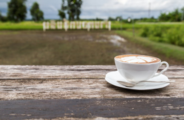 cup of coffee on wood table